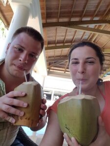 people drinking fresh coconut water