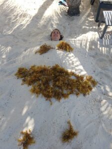 Woman buried in sand