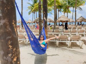 Relaxing in a hammock between two palm trees